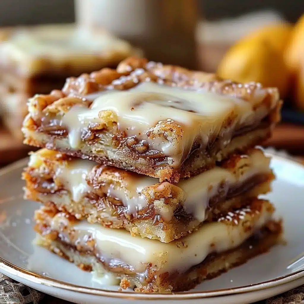 Cinnamon Roll Bliss Bars: Your Cozy Dessert Delight! 4 Delicious cinnamon roll bars topped with icing, perfect cozy dessert.
